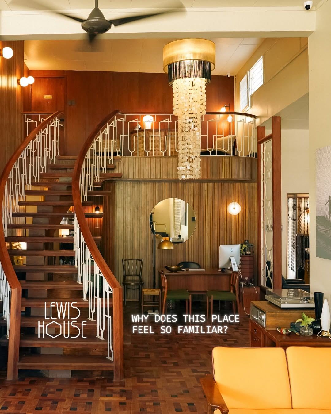 The Lewis House grand staircase interior with capiz chandelier