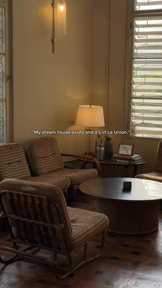 Intimate corner seating with reading lamp and woven chairs